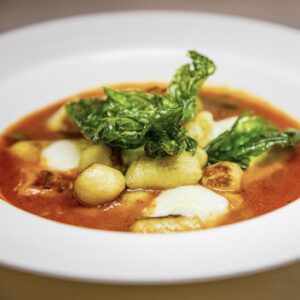 Gnocchi stuffed with fresh Mozzarella in a tomato confit broth